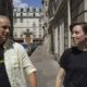 The Inspirer's founders Em and Kevin Barrett walking on a sidewalk in Paris